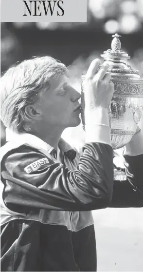  ?? ALLSPORT UK / ALLSPORT ?? Boris Becker kisses the winner’s trophy after capturing the Wimbledon men’s title in 1985. Becker’s trophy from the tournament is one of two that remain missing.