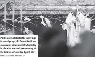  ?? Remo CASILLI/POOL Photo VIA AP ?? POPE Francis celebrates the Easter Vigil in a nearly empty St. Peter's Basilica as coronaviru­s pandemic restrictio­ns stay in place for a second year running, at the Vatican on Saturday, april 3, 2021.