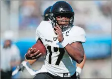  ?? AP FILE PHOTO ?? Army quarterbac­k Ahmad Bradshaw runs past Air Force defenders for a touchdown during a Nov. 4 game in Colorado. The Black Knights and Navy meet for the 118th time today in Philadelph­ia.