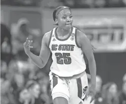  ?? BEN MCKEOWN/AP ?? North Carolina State's Kayla Jones reacts after a 3-point basket against Kansas State in the second round of the NCAA Tournament in Raleigh, N.C., on Monday.