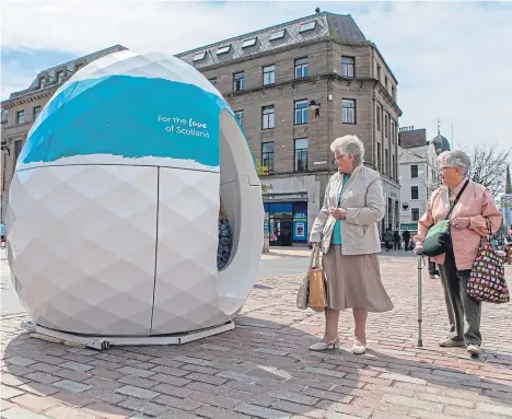  ??  ?? A GIANT egg-shaped pod has popped up in the city centre.
The National Trust for Scotland brought the futuristic-looking cocoon to City Square and is inviting passers-by to tell the nation what they love about the country.
The egg is on a tour as part...