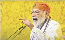  ?? PTI ?? PM Narendra Modi speaks at an event held to commemorat­e the 400th birth anniversar­y of the ninth Sikh Guru at Red Fort.