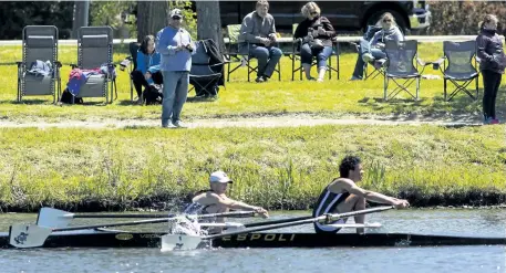  ?? JULIE JOCSAK/POSTMEDIA NEWS ?? Kyle D'addio, left, and Andrew Laliberte of Saint Paul High School row in the junior mens double during the SNRC High School Invitation­al Regatta at the South Niagara Rowing Club on Saturday.