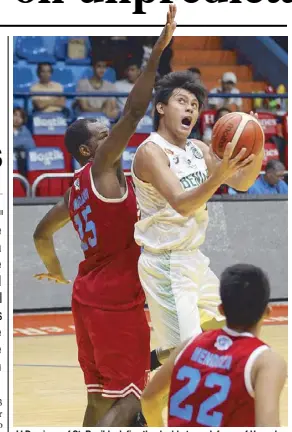  ?? JUN MENDOZA ?? JJ Domingo of St. Benilde defies the double team defense of Hamadou Laminou and Jethro Mendoza of Emilio Aguinaldo College in their NCAA game yesterday at the Filoil Flying V Center.