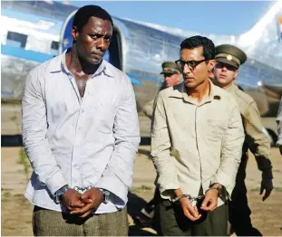  ?? PICTURE: AP ?? ON THE BIG SCREEN: Idris Elba, left, as Nelson Mandela, and Riaad Moosa, as Ahmed Kathrada, in the 2013 film Mandela: Long Walk to Freedom, which was produced by Anant Singh.