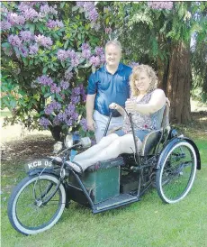  ??  ?? Left: Samantha and Andrew Snucins stand with their 1974 Austin 1000 Mini, which was restored by a group of enthusiast­s for free. Above: Dave and Tricia Liversidge demonstrat­e the way her great uncle, whose legs were paralyzed, would drive his 1934...