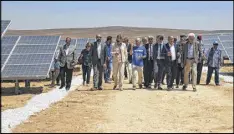  ?? ELENA BOFFETTA / ASSOCIATED PRESS ?? Officials from the Ikea Foundation and the U.N. refugee agency tour a newly inaugurate­d solar energy plant that will provide about 20,000 Syrian refugees in Jordan with electricit­y.