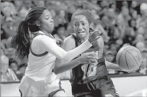  ?? Arkansas Democrat-Gazette/STEPHEN B. THORNTON ?? North Little Rock’s Amber Hawkison defends against Fayettevil­le’s Maya Mayberry during the second half. Mayberry finished with 14 points. Hawkison had nine points and five rebounds.