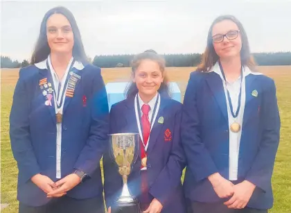  ?? Photo/ Supplied ?? Kate Rowland (left), Brooke Murphy and Isabella Jenkins with their medals from the national secondary schools clay target championsh­ips.