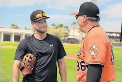  ?? KARL MERTON FERRON/BALTIMORE SUN ?? Ron Johnson, right, is entering his sixth season managing the Tides. He is a key player in helping the Orioles get the most out of their minor league depth.