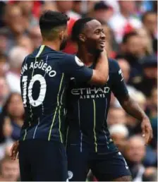  ??  ?? L-R: Manchester City’s Sergio Aguero and Raheem Sterling celebratin­g the 2-0 defeat of Arsenal in their first 2018/2019 season Premier League clash at the Emirates Stadium…yesterday