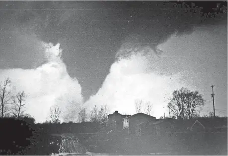  ?? HOLLAND SENTINEL FILE ?? A tornado hits Hudsonvill­e on April 3, 1956.