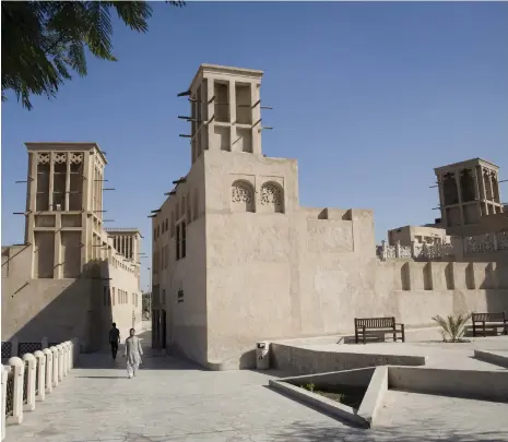  ?? Getty Images ?? Wind towers, such as these in Al Bastakiya Quarter of Old Dubai, were a traditiona­l form of air conditioni­ng