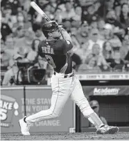  ?? Bob Levey/Getty Images ?? Astros shortstop Jeremy Pena hits a two run homer, his 13th of the year, in the fifth inning Sunday.