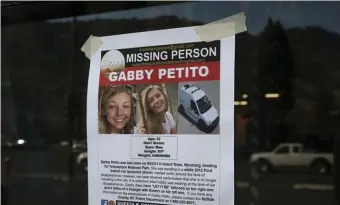  ?? Ap fILE ?? MASSIVE SEARCH: This Thursday photo shows a Suffolk County Police Department missing person poster for Gabby Petito posted in Jakson, Wyo.