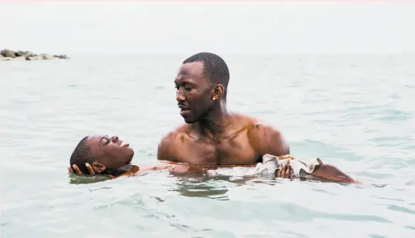  ?? David Bornfriend / A24 2016 ?? Alex Hibbert (foreground) and Mahershala Ali in last year’s best picture, “Moonlight.”