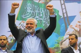  ?? Adel Hana / Associated Press 2014 ?? Ismail Haniyeh, Hamas’ new leader, greets backers in the Gaza Strip in 2014. The former Gaza prime minister succeeds exiled Hamas leader Khaled Mashaal.