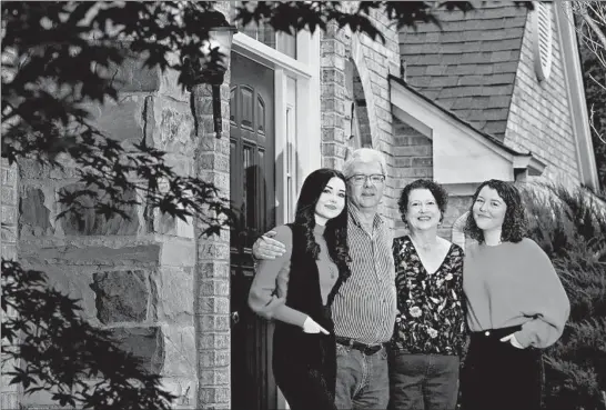  ?? STACEY WESCOTT/CHICAGO TRIBUNE ?? David Boden and Nancy Frohman, flanked by their daughters Alexa, left, and Mariel Boden, both became seriously ill with COVID-19 and were placed on ventilator­s. The couple survived.