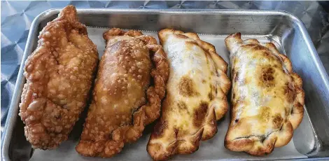  ?? Jody Schmal / Houston Chronicle ?? Empanada Factory offers both baked and fried varieties of the handmade savory pies.