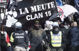  ?? GRAHAM HUGHES, THE CANADIAN PRESS ?? A Montreal anti-fascist group is calling on anti-racist groups to head to Quebec City to oppose a demonstrat­ion by La Meute. A member of the right-wing group participat­ed in the white supremacis­t rally in Charlottes­ville.