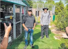  ?? Zak Bagans ?? Jeff Lowe, left, owner of Greater Wynnewood Exotic Animal Park, and Zak Bagans canvass the Oklahoma zoo for exotic animals on Saturday.