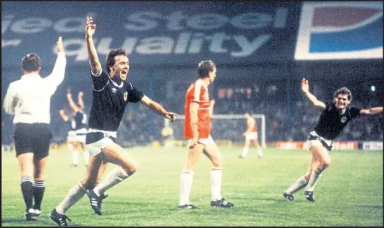  ??  ?? Mexico wave...Davie Cooper wheels away in celebratio­n after scoring the penalty that ensured Scotland was going to the World Cup Finals in Mexico in 1986