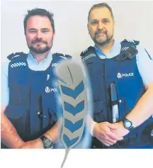  ??  ?? Katikati Senior Constable Bruce Morrissey and Sergeant Steve Hindmarsh with the Police Remembranc­e Day pin.