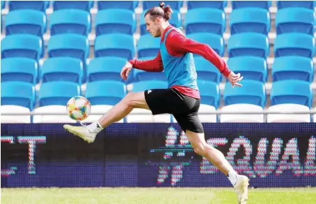  ?? Reuters/File ?? Gareth Bale during a training session. Bale says he wanted to get back into action but felt it wise to wait and see, amid the coronaviru­s outbreak.