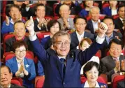  ?? CHUNG SUNG-JUN / GETTY IMAGES ?? Winning South Korean presidenti­al candidate Moon Jaein celebrates Tuesday in Seoul. He follows the previous president, who was impeached and is now in jail.