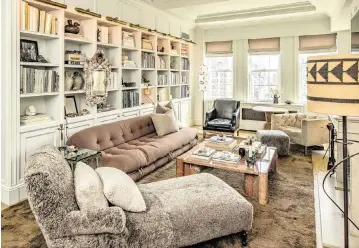  ?? PHOTOS BY TONY CENICOLA NYT ?? Top, organized shelving at the home of interior designer Jeremiah Brent in New York.
Below, he arranges a bookshelf at his home. Brent uses books to create pedestals for objects he and his husband, Nate Berkus, collect while traveling. At bottom,
Brent shows how he styles the shelves in his home in New York. ‘It’s about having fun and playing around with different ways to layer things in and tell your story,’ he said.