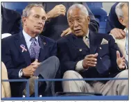  ?? (AP file photo) ?? Then-New York City Mayor Michael Bloomberg (left) talks with former Mayor David Dinkins during the 2004 U.S. Open tennis tournament in New York. One of Dinkins’ last mayoral acts in 1993 was to sign a deal with the U.S. Tennis Associatio­n that guaranteed the U.S. Open would remain in New York City for decades.