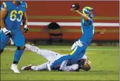  ?? RANDY VAZQUEZ — BAY AREA NEWS GROUP ?? Los Angeles Rams quarterbac­k Jared Goff gets taken down by the 49ers’ Kerry Hyder Jr. as he throws during the third quarter on Sunday.