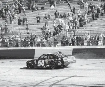  ?? MIKE CAUDILL AP ?? Ty Gibbs does a victory lap after winning a NASCAR Xfinity Series race Saturday at Richmond Raceway.