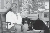  ?? [PHOTO PROVIDED] ?? A resident at the Sunbeam Family Services shelter for older adults sits with the facility’s therapy dog.