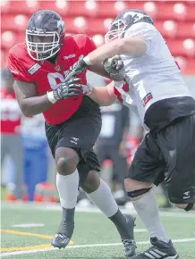  ?? TOOMBS/ CALGARY HERALD
ARYN ?? Stampeders defensive lineman Derek Wiggan, left, breaks away during a drill earlier this season. He is gaining more responsibi­lity for the club and could see increased action as starters rest against B. C. on Saturday.