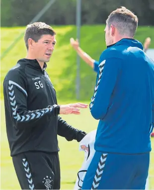  ?? Picture: SNS Group. ?? “Second chance to redeem myself”: Manager Steven Gerrard talks with Kyle Lafferty at training ahead of the clash with Ufa.