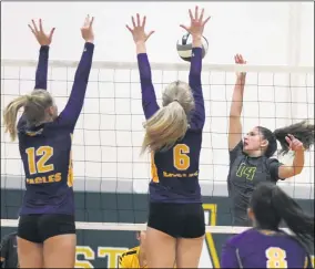  ??  ?? Delaney Kitchen of Amherst hits past Emma Farney, right, and Avery Abfall of Avon during the second set Sept. 22. RANDY MEYERS — FOR THE MORNING JOURNAL