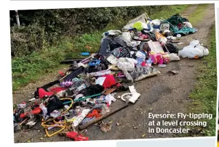  ??  ?? Eyesore: Fly-tipping at a level crossing in Doncaster