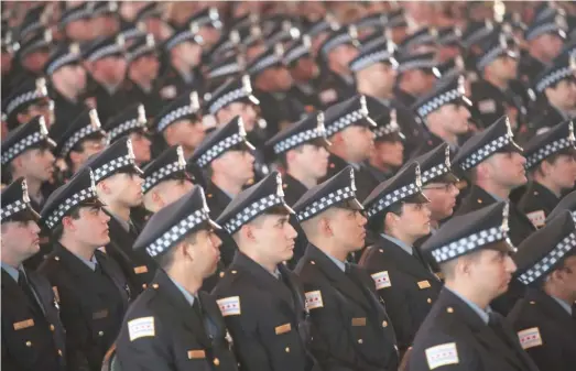  ?? SCOTT OLSON/GETTY IMAGES ?? Chicago police officers attend a graduation and promotion ceremony in the Grand Ballroom on Navy Pier on June 15, 2017.