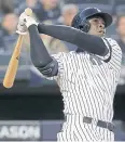  ?? AP ?? The Yankees’ Didi Gregorius follows through on a grand slam home run.