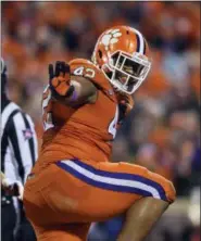  ?? ASSOCIATED PRESS FILE ?? Clemson’s Christian Wilkins does the Heisman pose after scoring a touchdown during the first half against South Carolina, in Clemson, S.C.