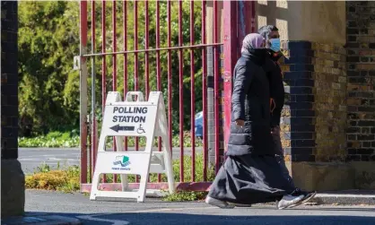  ??  ?? People leave a polling station in Tower Hamlets, London. Photograph: Vickie Flores/EPA