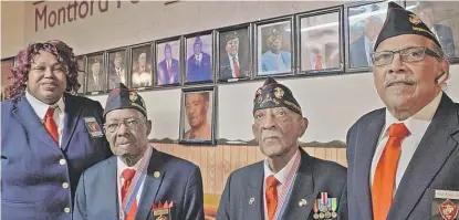  ?? ANNIE COSTABILE/SUN-TIMES PHOTOS ?? ABOVE: Sharon Stokes-Parry (from left), Frank Thrasher, James Reynolds and Paul Knox at the Montford Point Marines veteran center in Englewood. RIGHT: Historic photos that line the walls of the building have been damaged by a leaking roof.