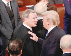  ?? — Reuters ?? US President Donald Trump talks with US Supreme Court Chief Justice John Roberts.