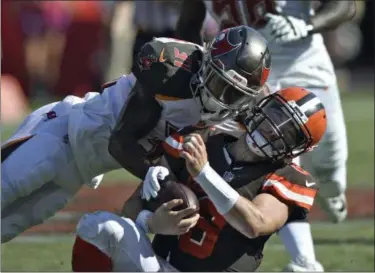  ?? JASON BEHNKEN — THE ASSOCIATED PRESS ?? Tampa Bay Buccaneers defensive back Jordan Whitehead (31) hits Cleveland Browns quarterbac­k Baker Mayfield (6) during the second half on Oct. 21 in Tampa, Fla.
