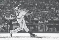  ?? MARK J. REBILAS/USA TODAY SPORTS ?? Giants pitcher Madison Bumgarner hits a solo home run against the Diamondbac­ks on Sunday in Phoenix. Bumgarner hit two home runs in the game, but the Giants lost 6-5.