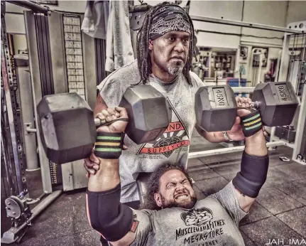 ??  ?? Father and son: Jone Seru doing weight training with his son Zaac Seru, a.k.a, Prolifik The Gifted.