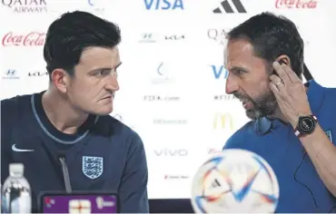  ?? ?? ↑ Maguire and Gareth Southgate at a media briefing at the Qatar National Convention Center