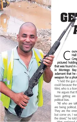  ?? CONTRIBUTE­D ?? Councillor Gregory Wint seen here with the weapon that was discovered following drain cleaning in MoBay after heavy rains late last week.