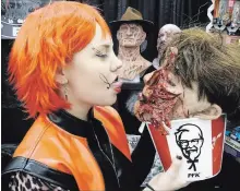  ?? JOHN LAW
THE NIAGARA FALLS REVIEW ?? Esther McCleery of Toronto makeup FX shop Blood Opera has a finger-lickin' good time at this weekend's Frightmare in the Falls.